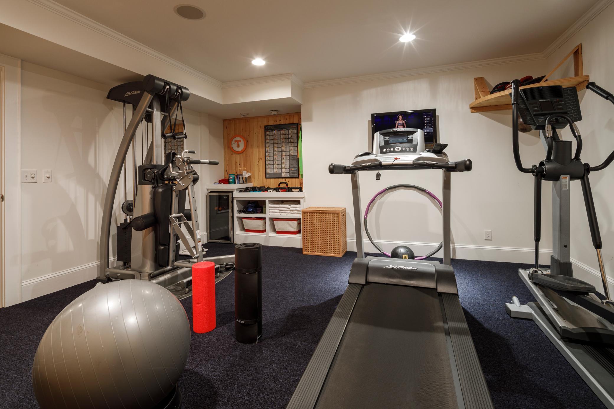 Exercise room with attached sauna.