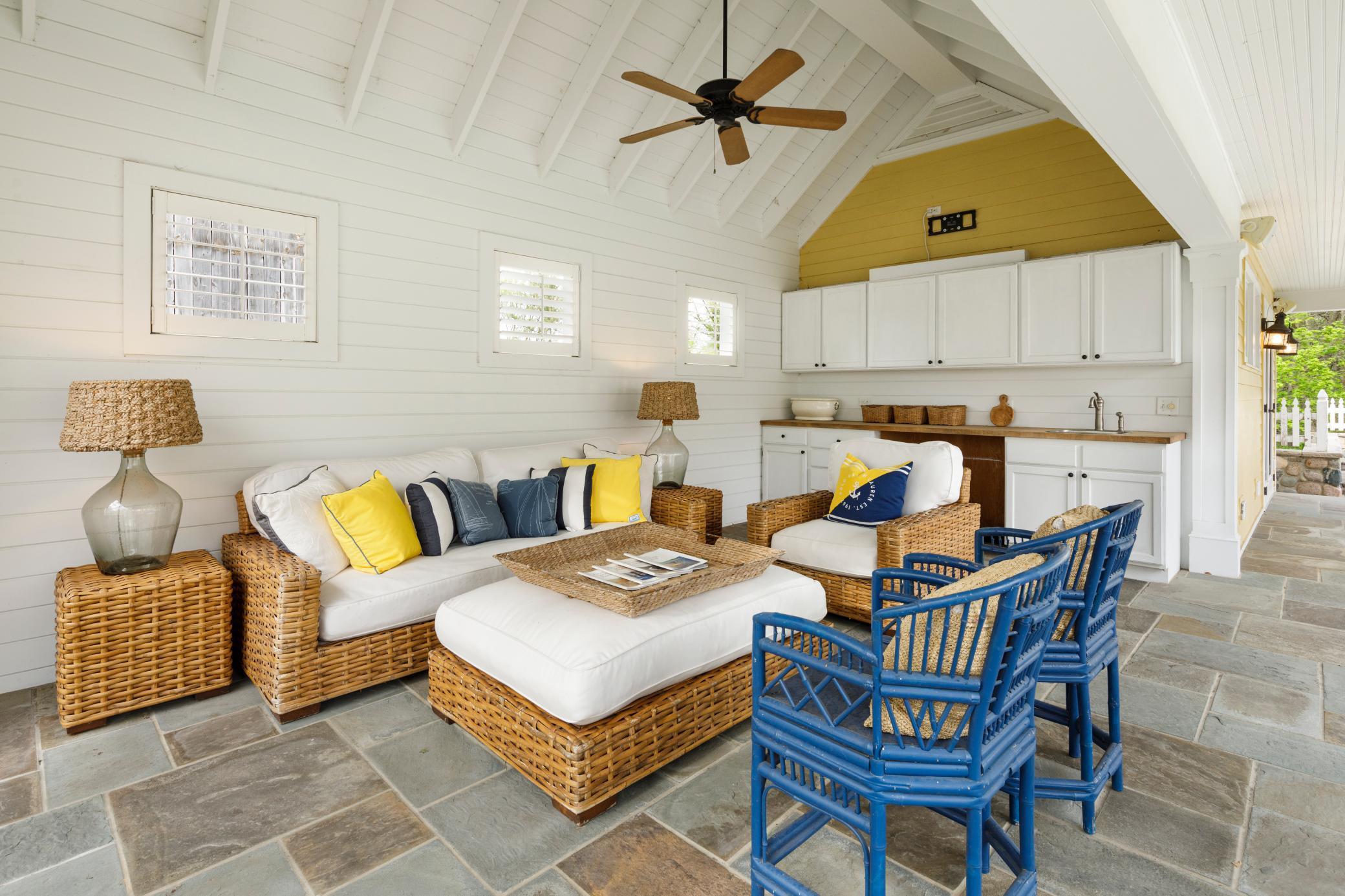 Enjoy summer evenings and gatherings in this wonderful space off the pool house.