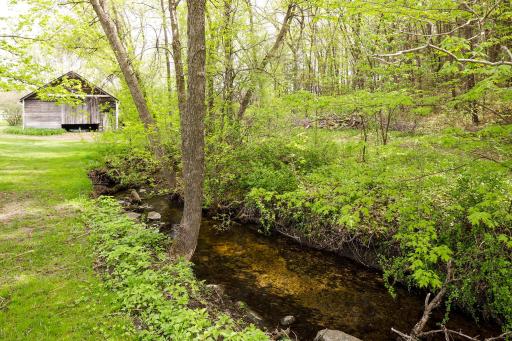 Explore the private 10-acres in enjoy a creek, fully fenced property, stroll the pastures, and private bridle path with direct access from the farm to trails.