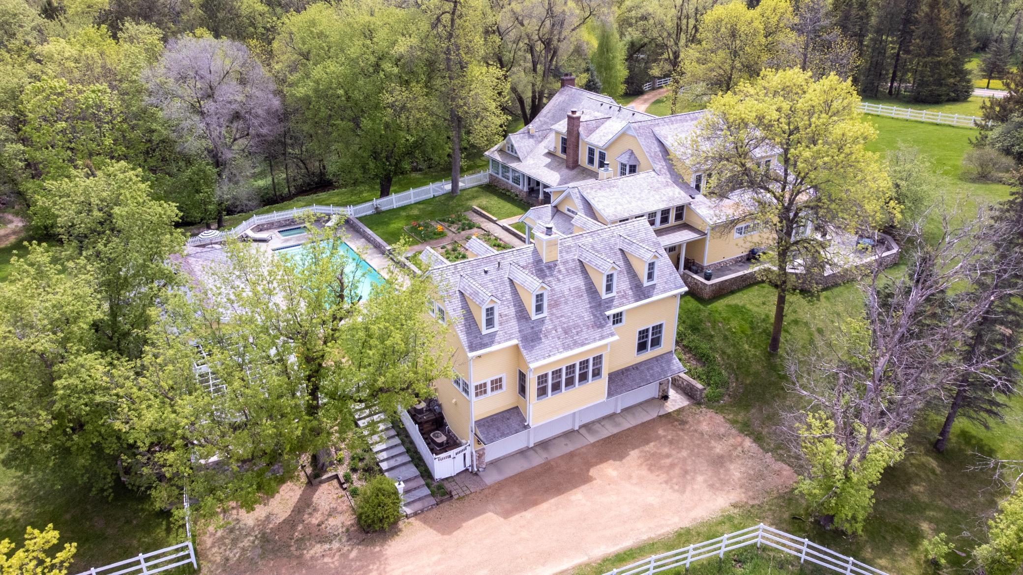 Four car garage tucked under and connect to the home via private tunnel.