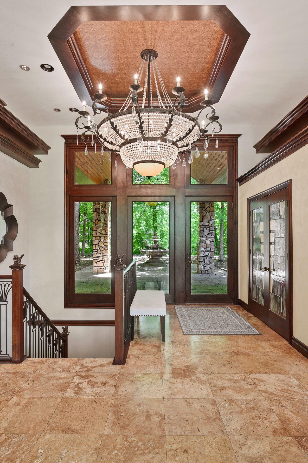Gorgeous entryway with statement Italian made chandelier.