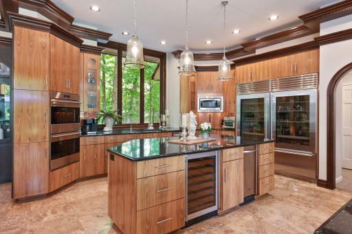 Double Subzero fridges, trash compactor, and wine fridge plus double wall ovens.