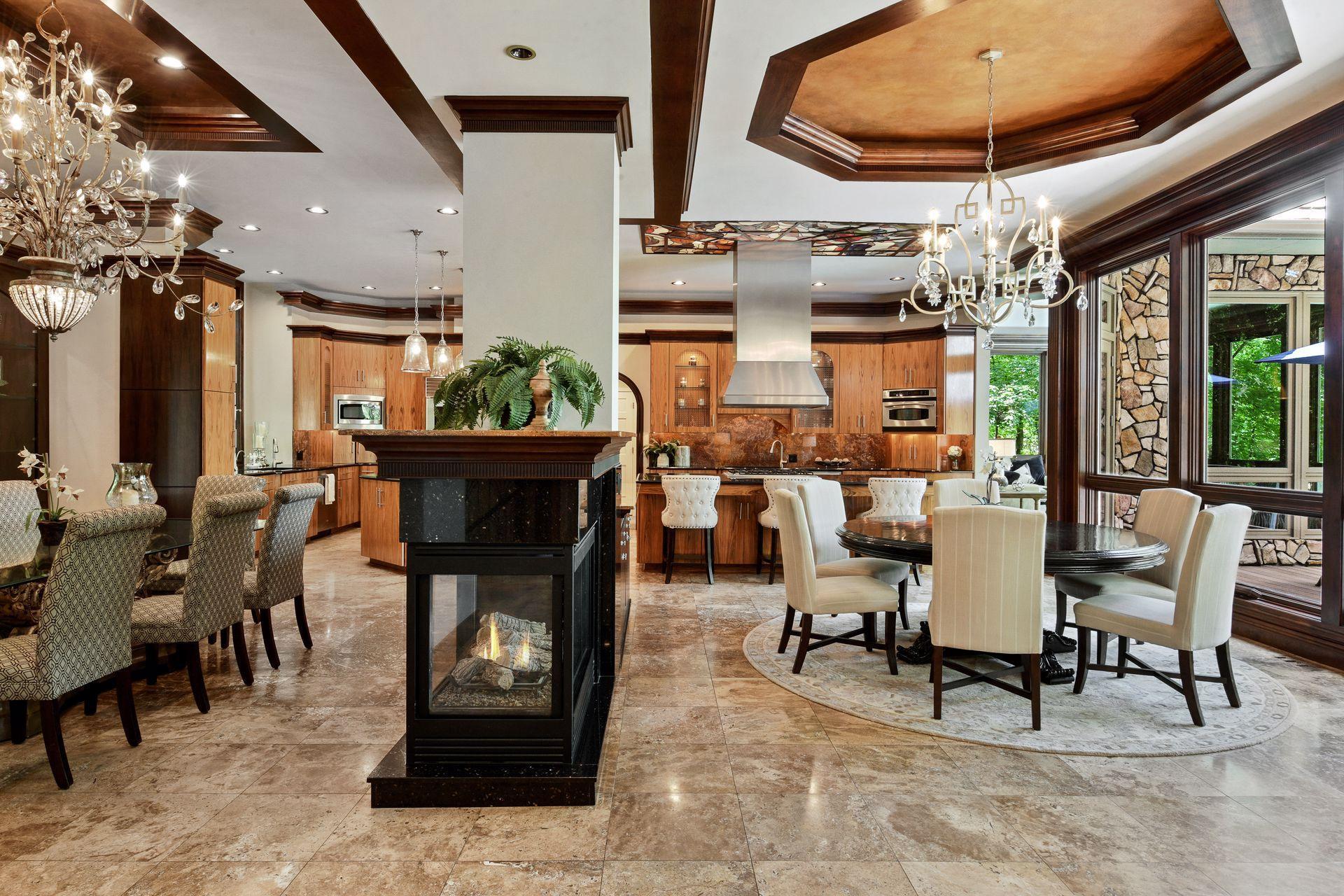Three-sided fireplace separating the dining areas.