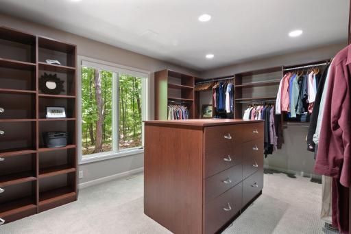 View out of Owner's closet window shows area where a playset could be set up or a grassy area created.
