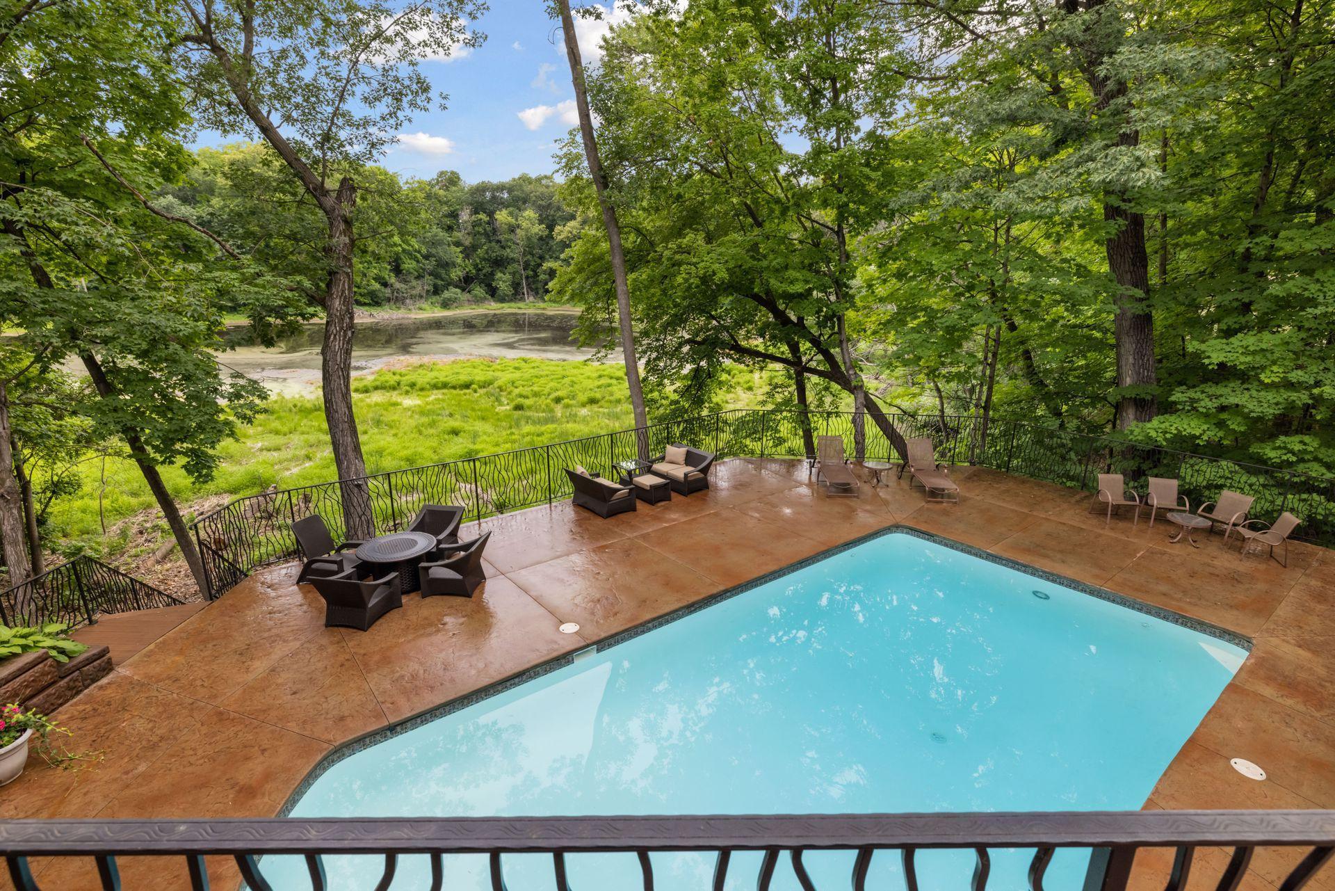 Pool deck with pond views