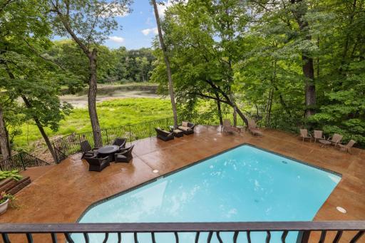 Pool deck with pond views