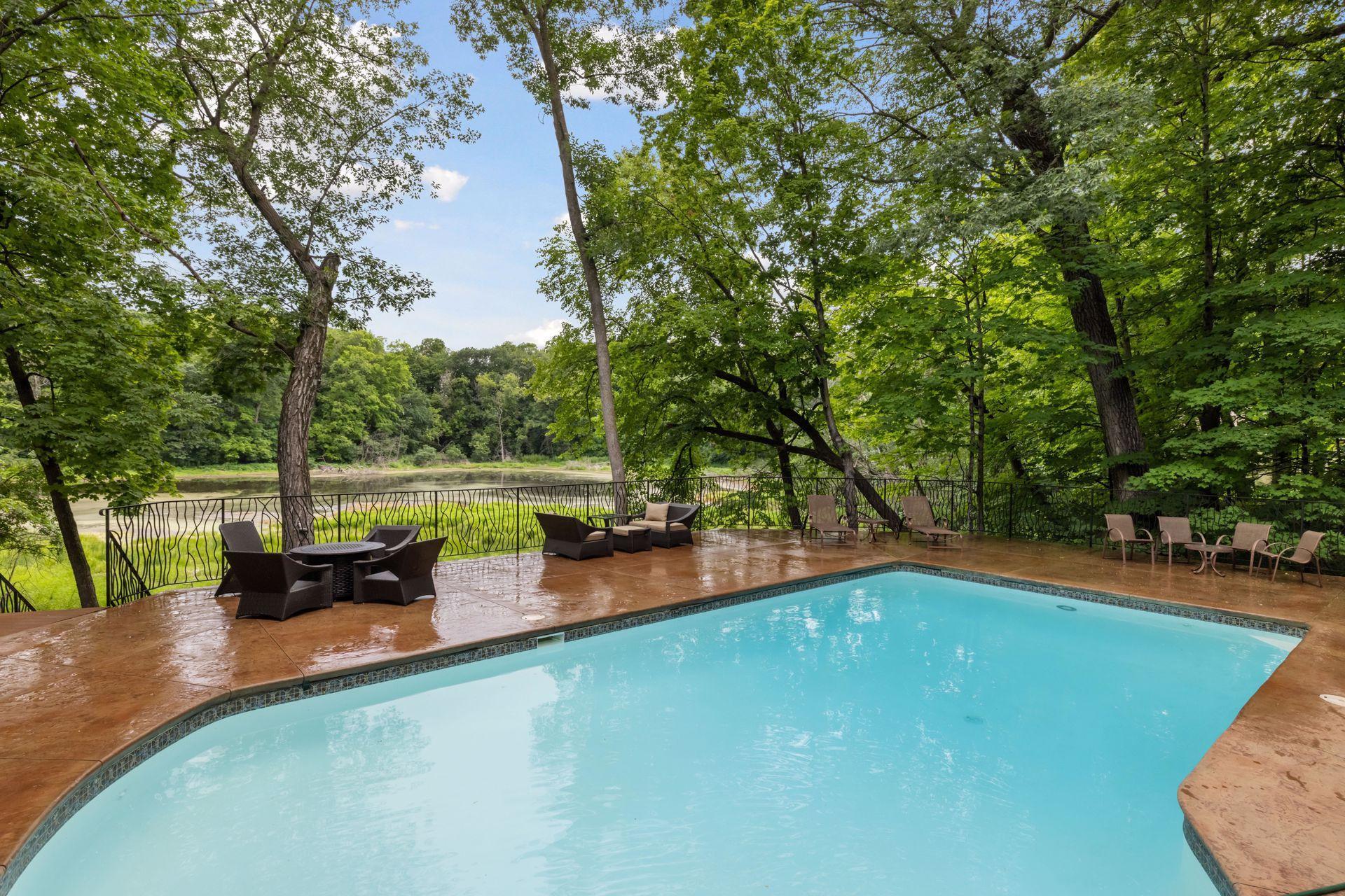 Pool deck with pond views