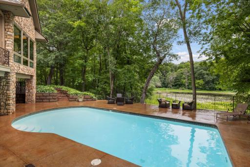 Pool deck with pond views