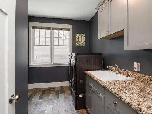 FPV view of Main floor laundry. Storage above and below sink. 244 Broadway Ave N Wayzata MN 55391