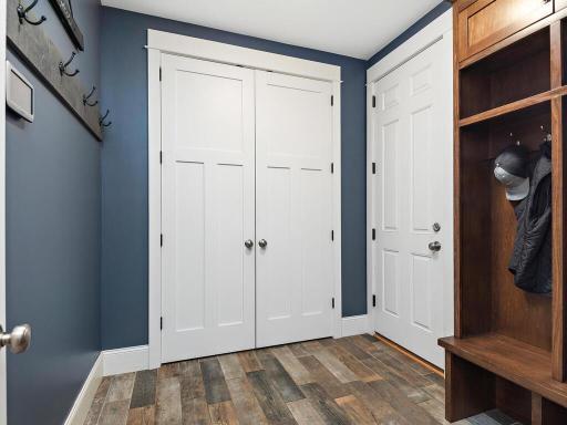 The mud room is generous in size, yet, not over done. The double doors provide additional floor to ceiling custom storage. The door to the right leads to your 876 sqft 3+ vehicle garage. 244 Broadway Ave N Wayzata MN 55391