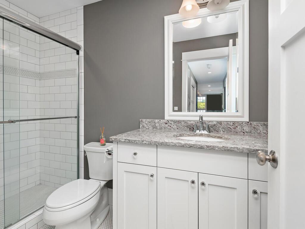 Bedroom #2 of 4 - Complimented by en suite bath w/ walk-in shower - your guests home away from home. 244 Broadway Ave N Wayzata MN 55391