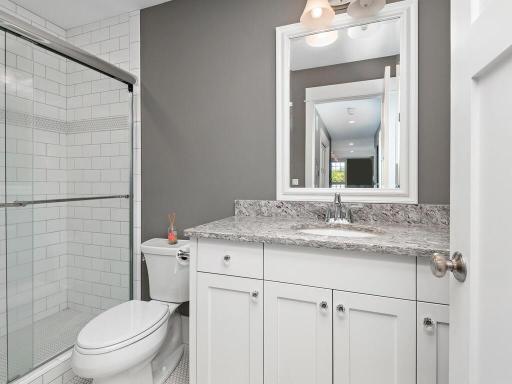 Bedroom #2 of 4 - Complimented by en suite bath w/ walk-in shower - your guests home away from home. 244 Broadway Ave N Wayzata MN 55391