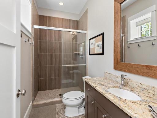 Private en suite bath for 3rd bedroom. The custom designed walk-in closet offers identical cubic space. 244 Broadway Ave N Wayzata MN 55391