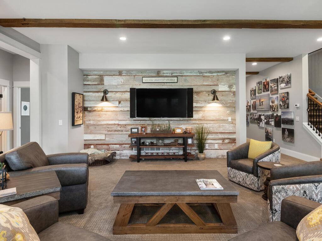 If in the future you decide to add a theatre screen, behind the wall w/ theTV rests a huge unfinished storage room. Wiring a permanent or drop down screen would be a piece of cake! 244 Broadway Ave N Wayzata MN 55391