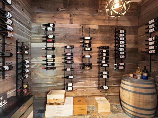 1,000 bottle wine room is all set up with temperature control. Just add the glass door! Barn wood used for wine cellar as well. The reverse side of the wood actually boasts the original red paint! 244 Broadway Ave N Wayzata MN 55391
