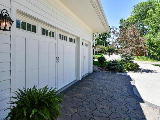 No where in Wayzata Village can one build a garage this size (3+ car). 876 sqft featuring interior level finishes. Knockdown ceilings, recessed lighting, heated, epoxy flooring, 35" TV, 8' ft doors, 11' ft ceilings 244 Broadway Ave N Wayzata MN 55391
