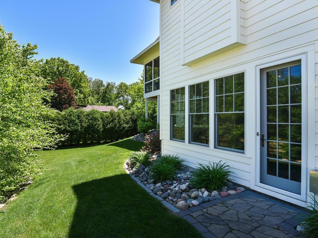 Walkout lower level leads to nearly 1/2 acre of grounds. There are a few options for locating a future 20x40 pool. Broadway Ave N Wayzata MN 55391