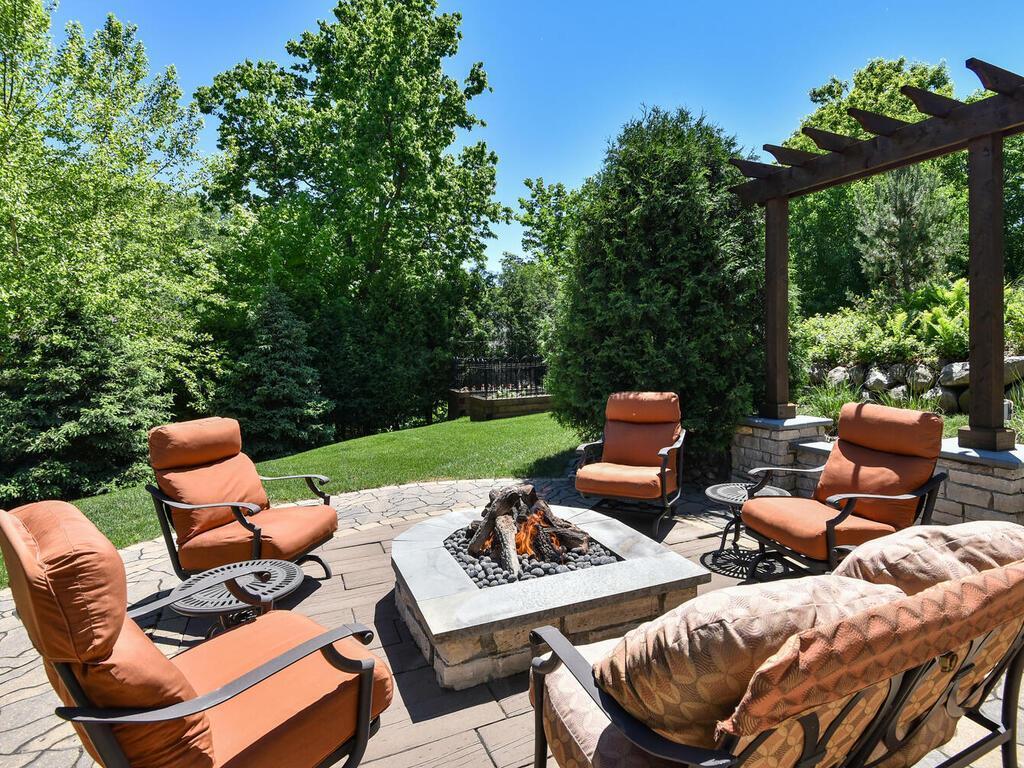 McCullough Design demonstrates creativity and bold design with this extraordinary custom paver patio and gas fire pit! The Pergola is wired and ready for outdoor theatre. 244 Broadway Ave N Wayzata MN 55391