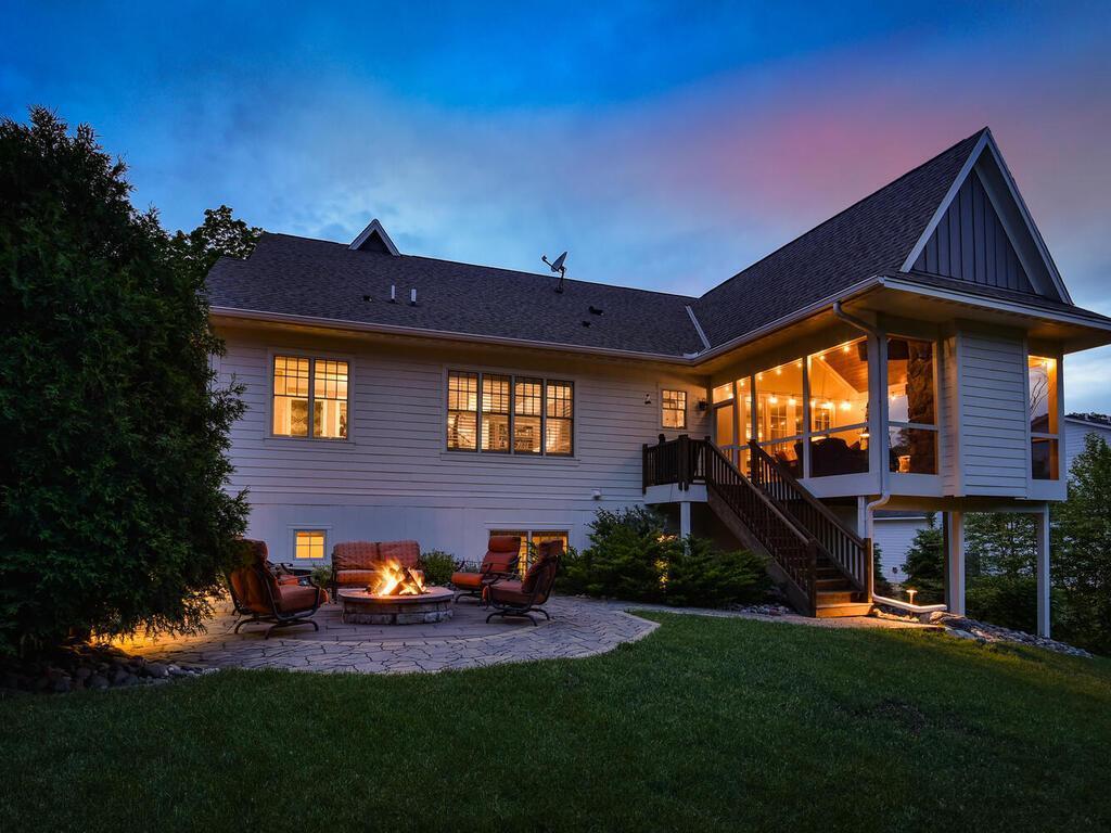 Eye level view from Southeast corner of the grounds. There are 2 raised gardens in this corner. The eastern border is framed by privacy bushes ard elevates well above the neighboring estate. 244 Broadway Ave N Wayzata MN 55391