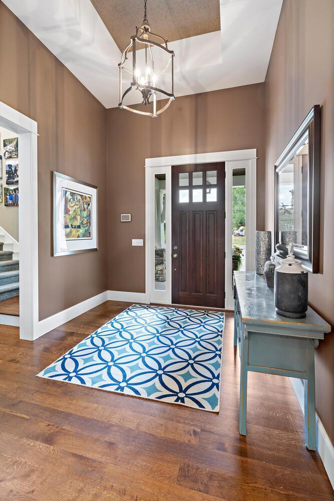 You're greeted by this mouth dropping entry with 15 ft box vault ceiling - accented by an eye popping chandelier. Custom 8 ft entryways and 8 ft mission doors throughout the main. 244 Broadway Ave N Wayzata MN 55391