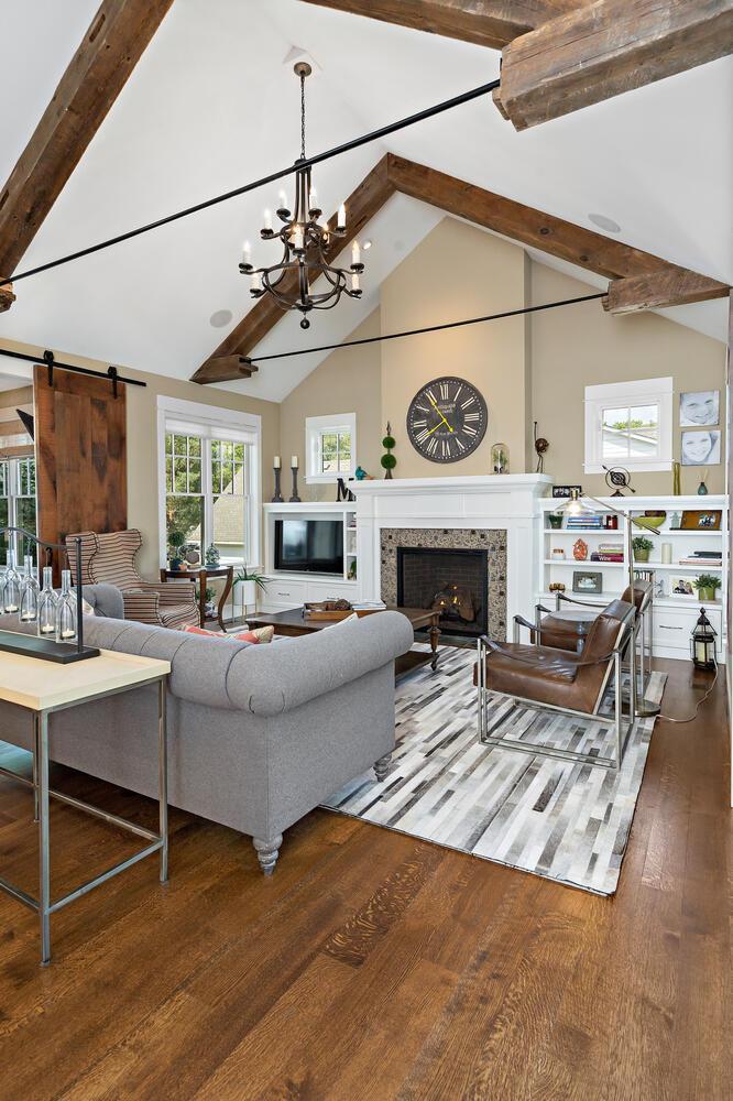 Wide plank wood flooring throughout main level accented by 8" baseboards throughout. Broadway Ave N Wayzata MN 55391