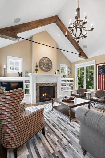 Reclaimed from a barn in Iowa, the hand hewn half beams are accented by this striking votive chandelier . 244 Broadway Ave N Wayzata MN 55391