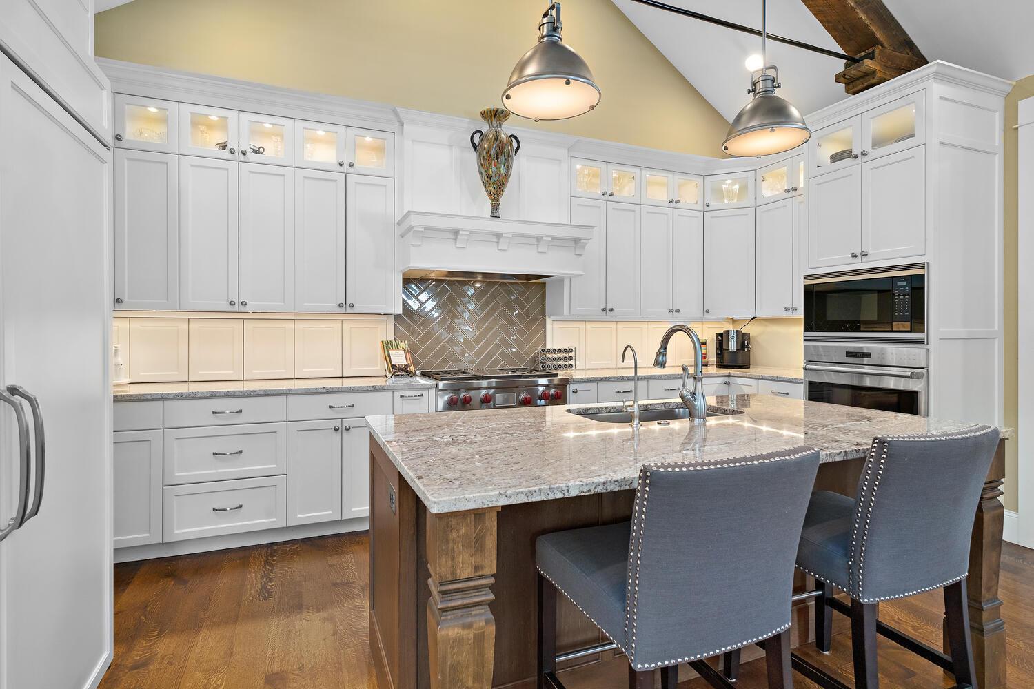 Ok, take a close look at the wall between the upper and lower cabinets. Yup! That's where you store all of your appliances! The granite counter tops flood directly into the appliance cuddies lining your counter. 244 Broadway Ave N Wayzata MN 55391