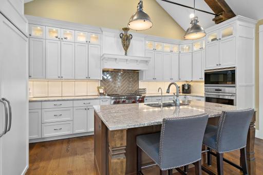 Ok, take a close look at the wall between the upper and lower cabinets. Yup! That's where you store all of your appliances! The granite counter tops flood directly into the appliance cuddies lining your counter. 244 Broadway Ave N Wayzata MN 55391