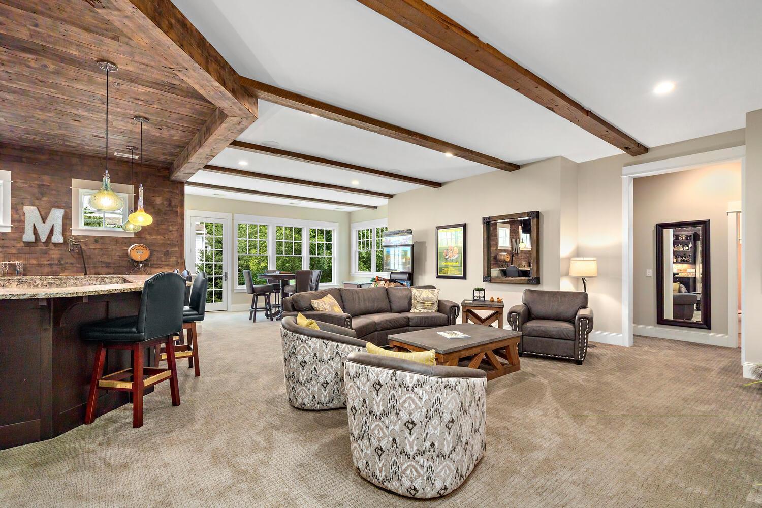 11' ft ceilings accented with hand hewn beams. These beams were reclaimed from the same barn in Iowa - By City Wide Floors, Cologne, MN 244 Broadway Ave N Wayzata MN 55391