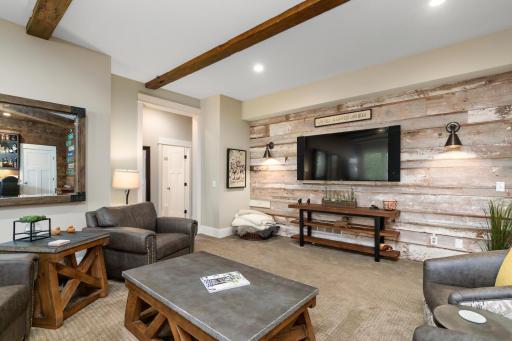 Beyond the family room rests the two lower level bedrooms. Buffering the bedrooms is the 4th of 5 baths which serves the bedroom to the left. The bedroom on the right offers 3/4 en suite and walk-in custom closet. 244 Broadway Ave N Wayzata MN 55391