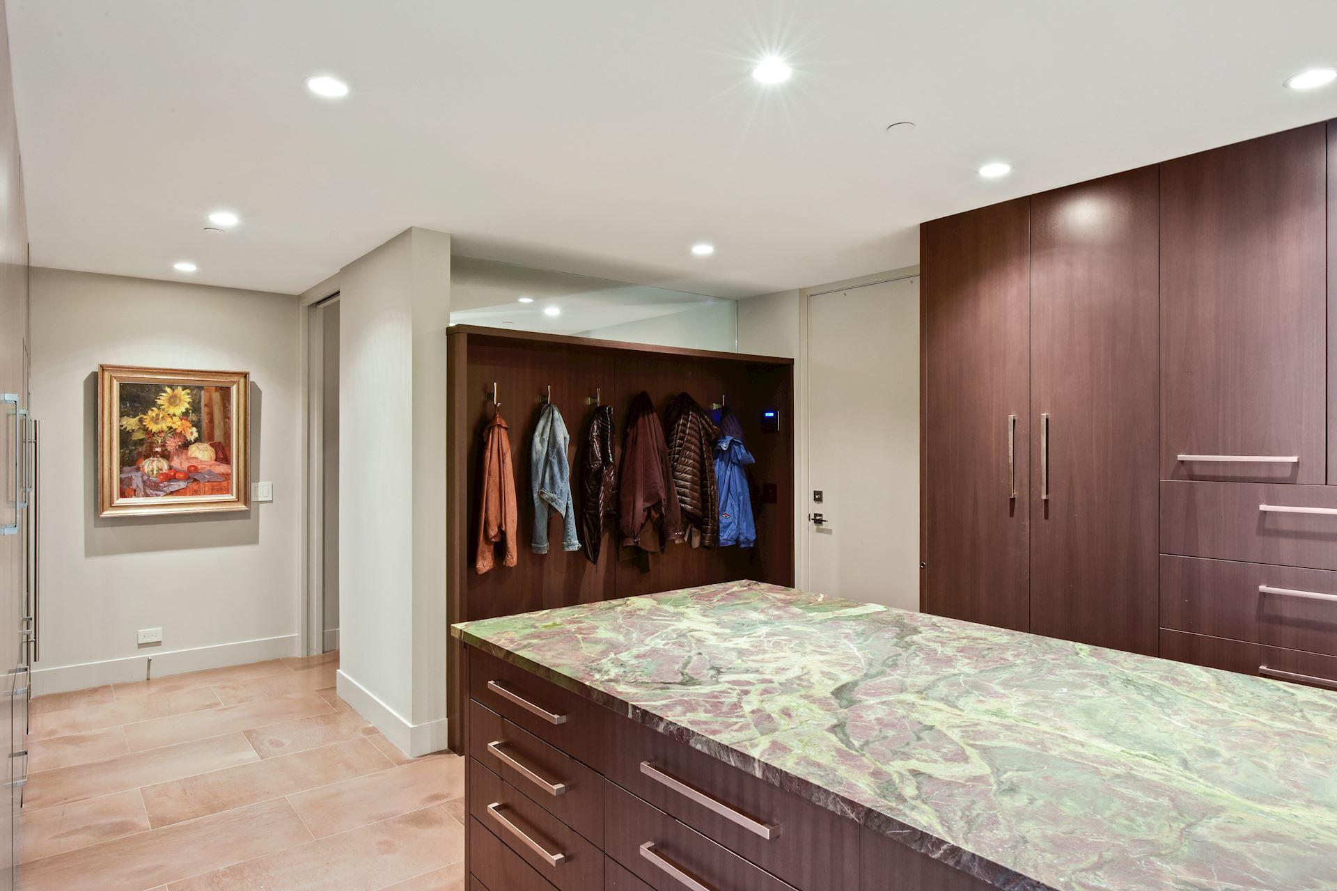 Mud room, has a full size sub zero wine frig, and a 2nd sub zero refrigerator