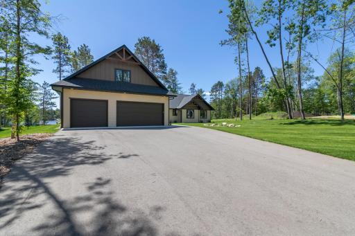 Nice paved driveway, which also has extra parking, leading to the home.