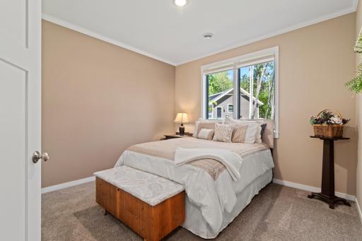 Nicely decorated main floor guest bedroom.