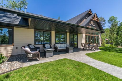On grade lakeside stamped concrete patio is perfect for relaxing after a long day.