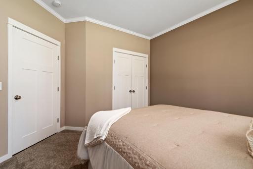 Guest bedroom has plenty of closet space and is close to the hall way bathroom.