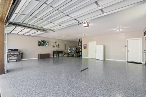 4 car attached garage is heated and has an epoxy painted floor.