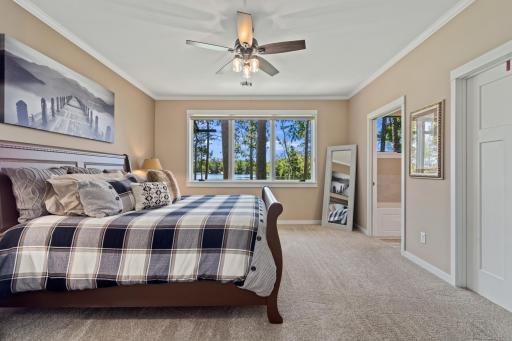 Main level master suite with lakeside views, on-suite and walk-in closet.