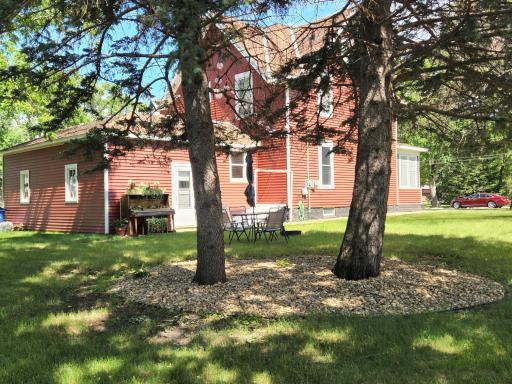 Photo for 314 Lyon Avenue N, Canby, MN 56220 - Listing #6227654 The sitting area and firepit, plus neatly landscaped under the pines.