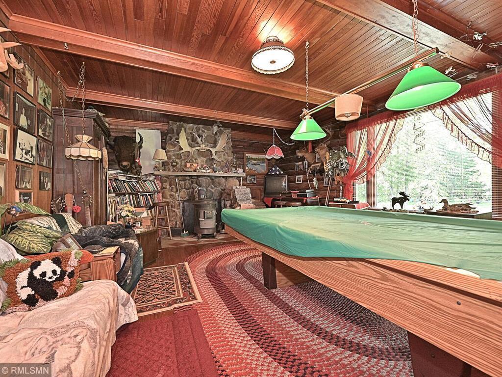 POOL TABLE ROOM WITH ROCK FIREPLACE