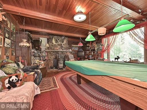 POOL TABLE ROOM WITH ROCK FIREPLACE