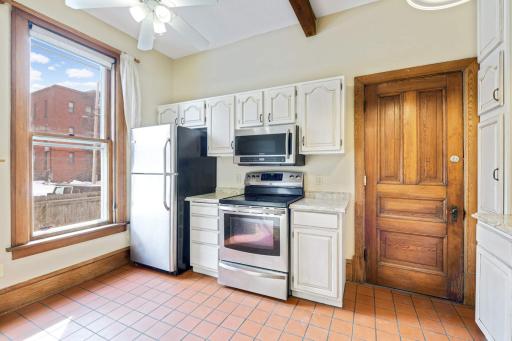 kitchen with stainless steel appliances and ample cabinet storage.
