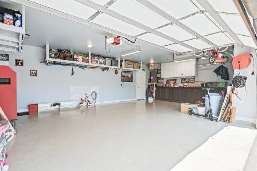 heated, insulated and epoxy floor garage. Cabinets included