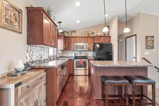 warm stained cabinets and center island