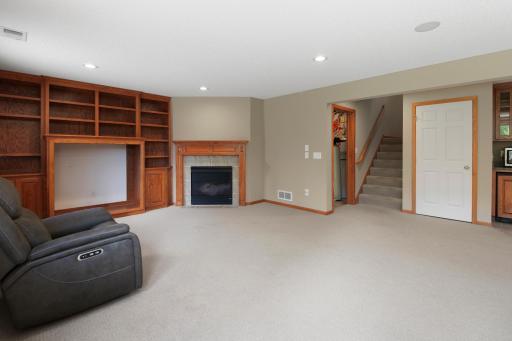 Other End of Family Room with Fireplace and Built-In Entertainment Center