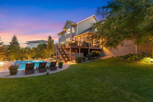 Beautiful outdoor spaces surround the pool.