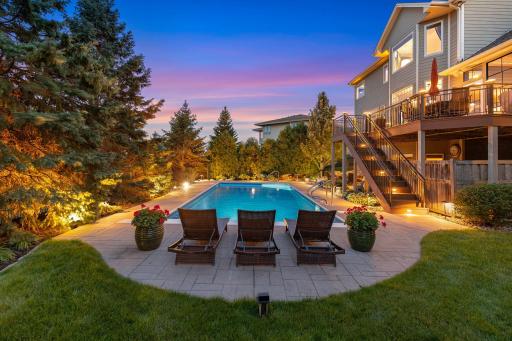 Custom lighting for the pool deck and backyard landscaping.