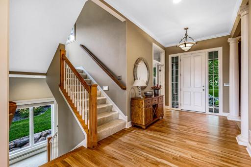 Upper and lower level staircase. Huge windows keep the stairs open and bright!