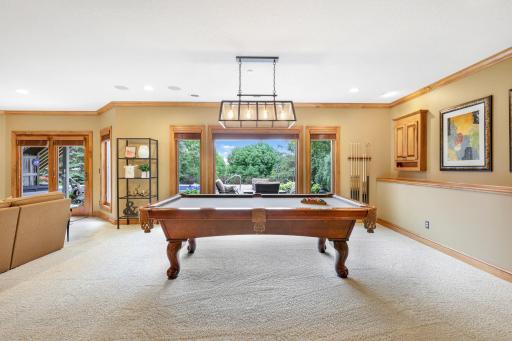 In addition, this level features in-floor radiant heat and walks directly out to the backyard pool and patios.