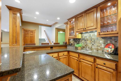 Cambria countertops, stone backsplash, and more custom built-ins.