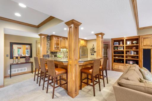 The ideal complement to these entertainment spaces is the full-size wet bar.